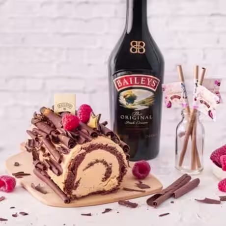 Baileys Original bottle and Yule log cake